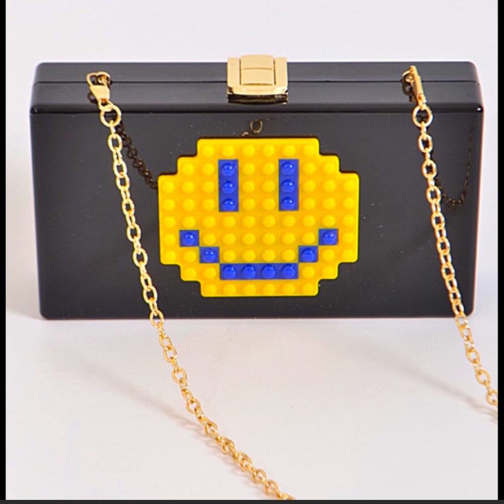 NWT. Happy face Acrylic Lego clutch.
